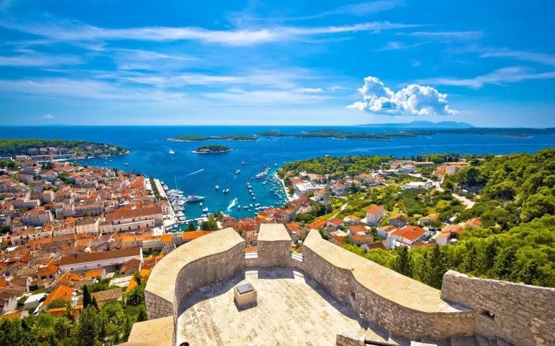 Panoramic view of Hvar Town harbor and the Pakleni Islands from Fortica Fortress, one of the most iconic sailing destinations in Croatia.
