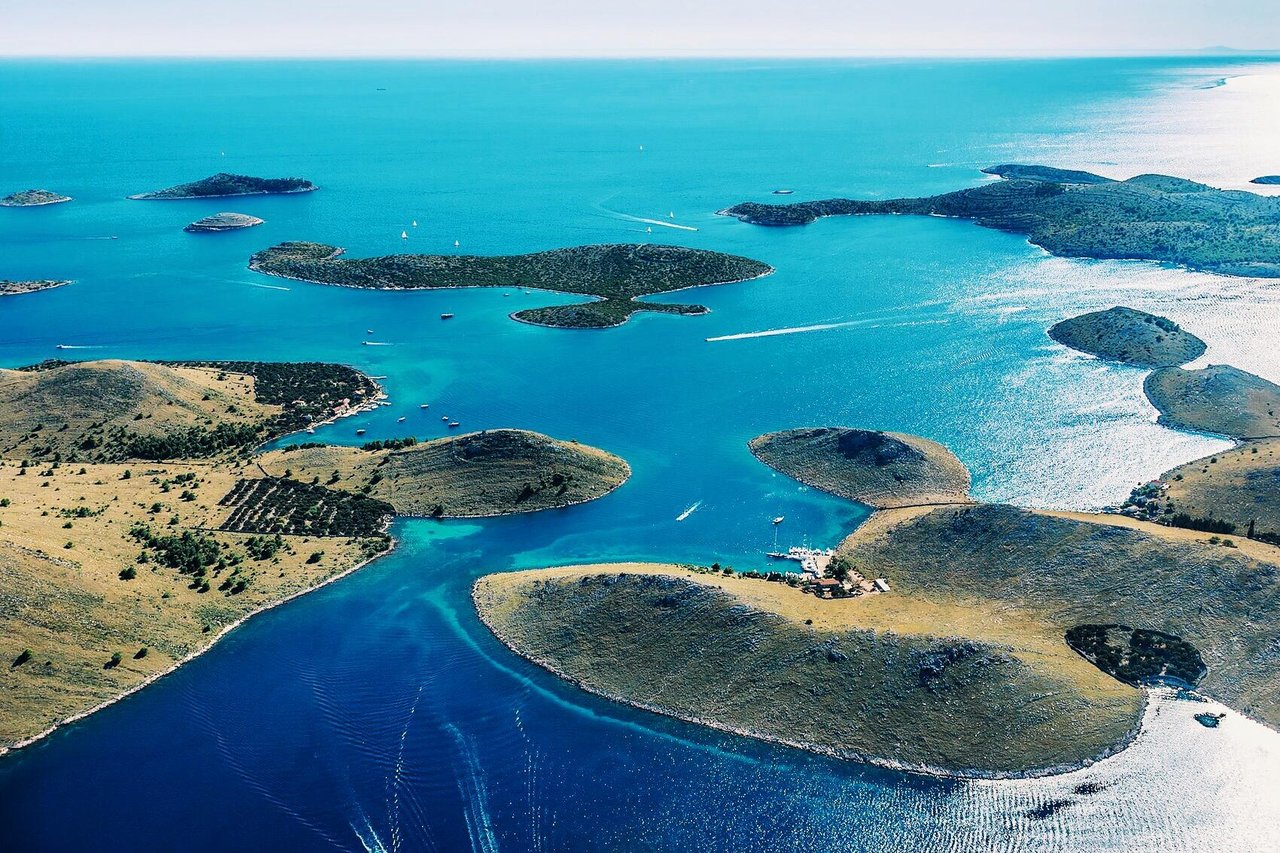 Aerial panoramic view of Adriatic islands with turquoise sea and scattered islets in Croatia