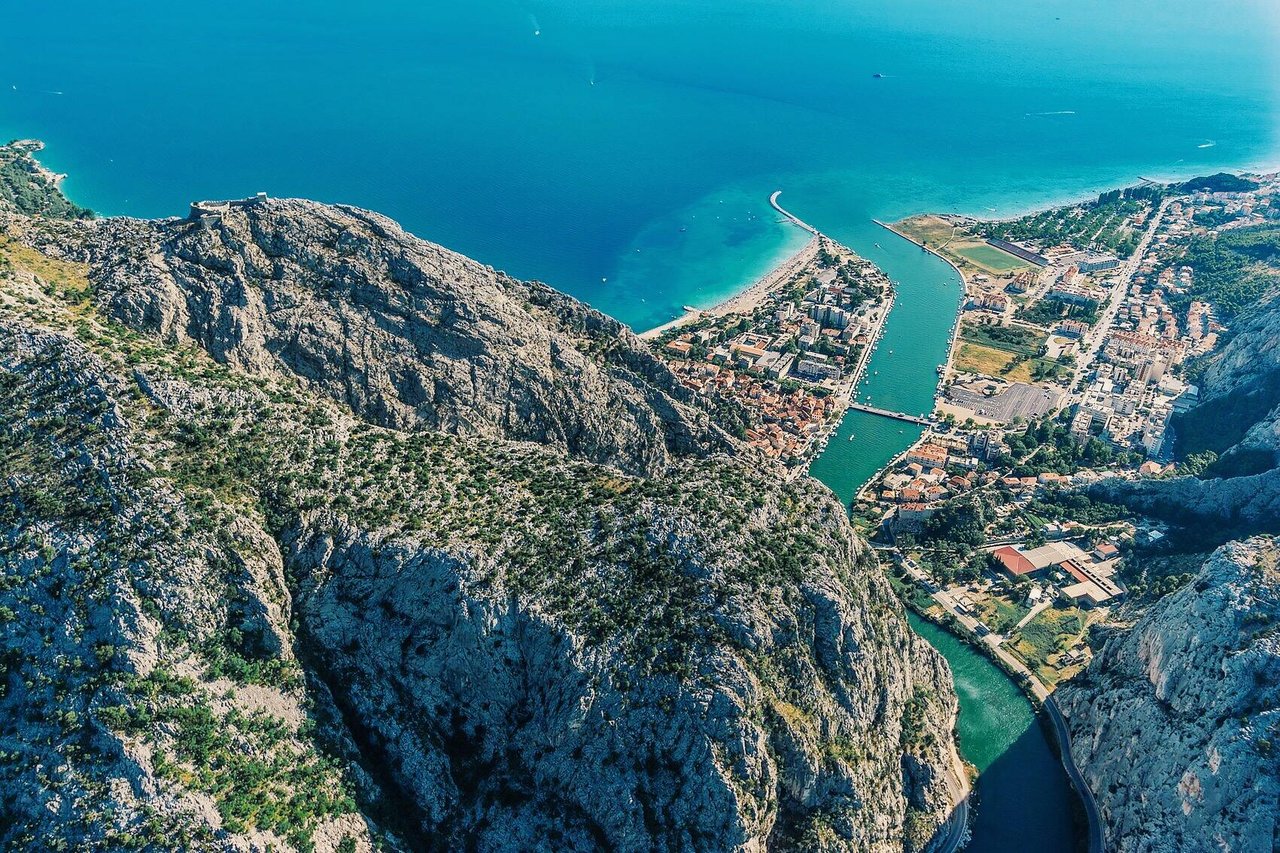 Aerial view of Omiš town, Cetina river canyon and Adriatic coastline in Croatia