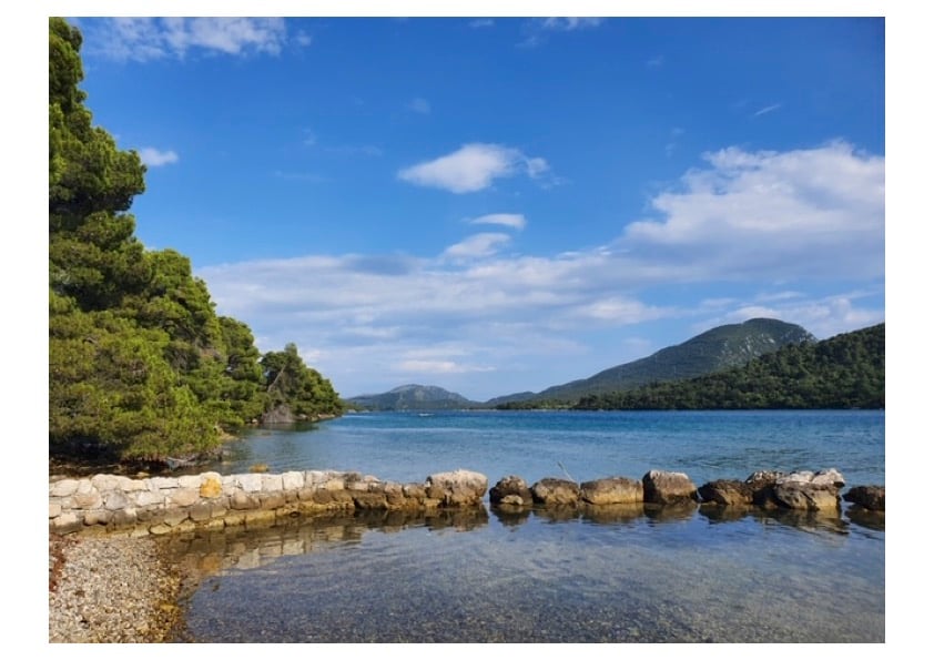 Scenic view of Ston Bay with clear sea and surrounding hills in Dalmatia, Croatia